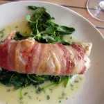 Monk Fish in bacon with parsley cream sauce